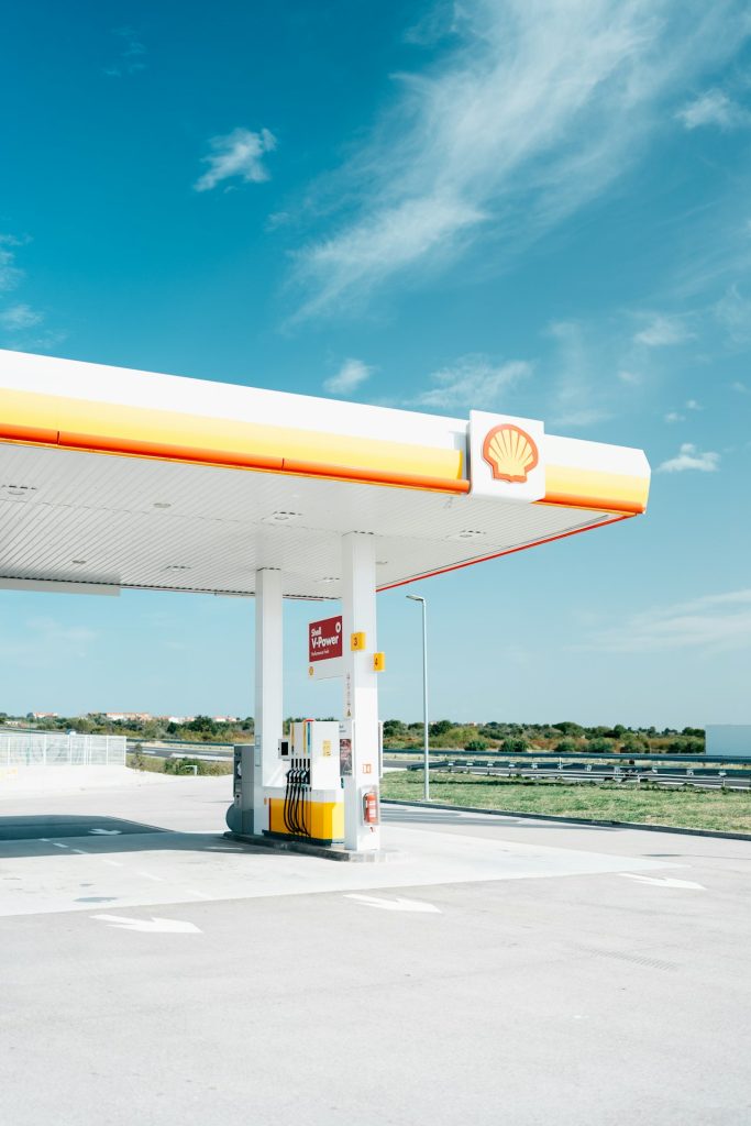An empty gas station with a blue sky in the background